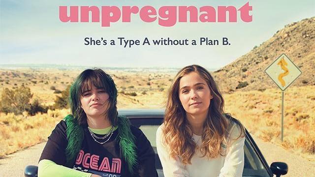 The movie poster for the movie "Unpregnant." It shows the two main characters sitting on the hood of a car in the desert. 