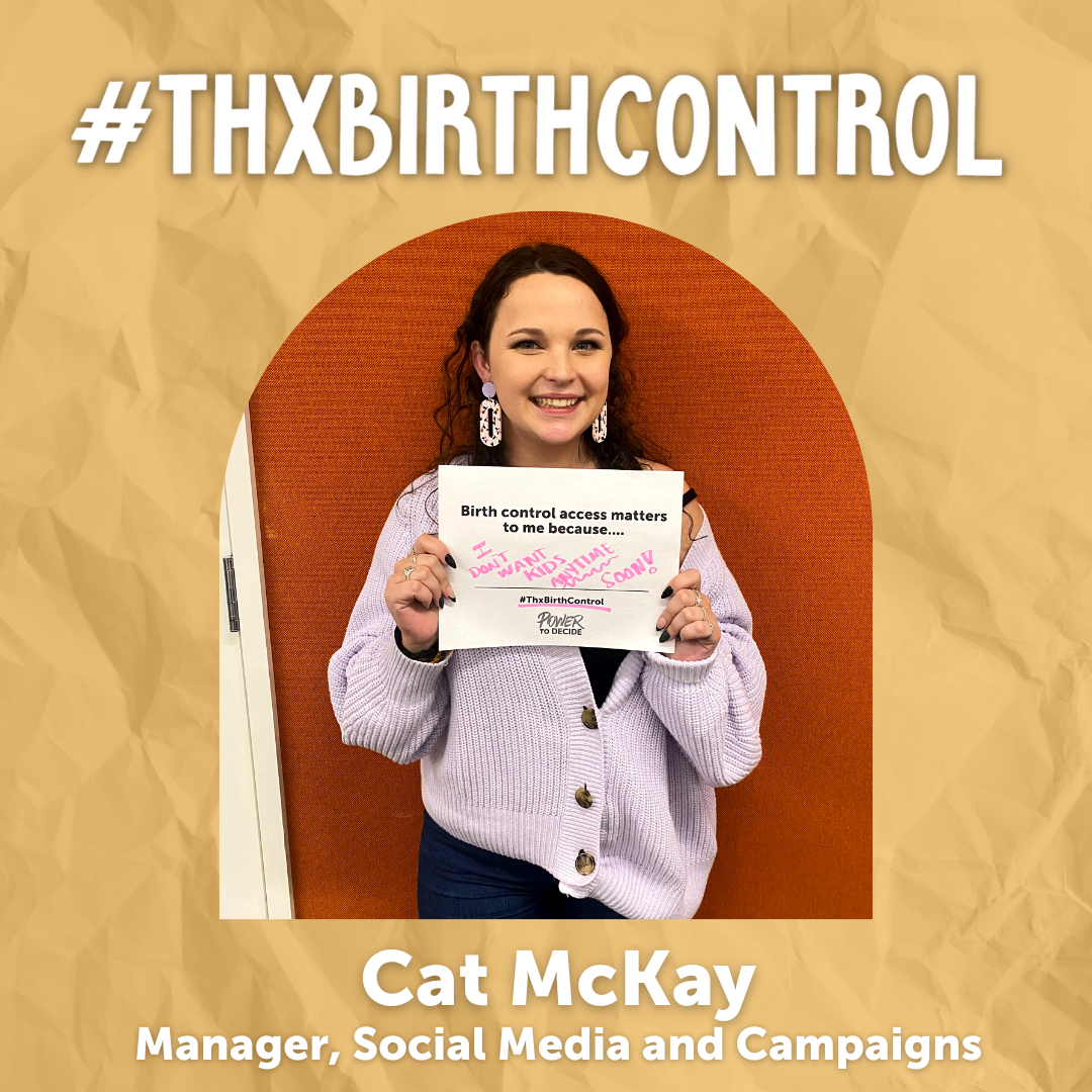 A Power to Decide Staffer holds a sign with their reason for saying #ThxBirthControl.