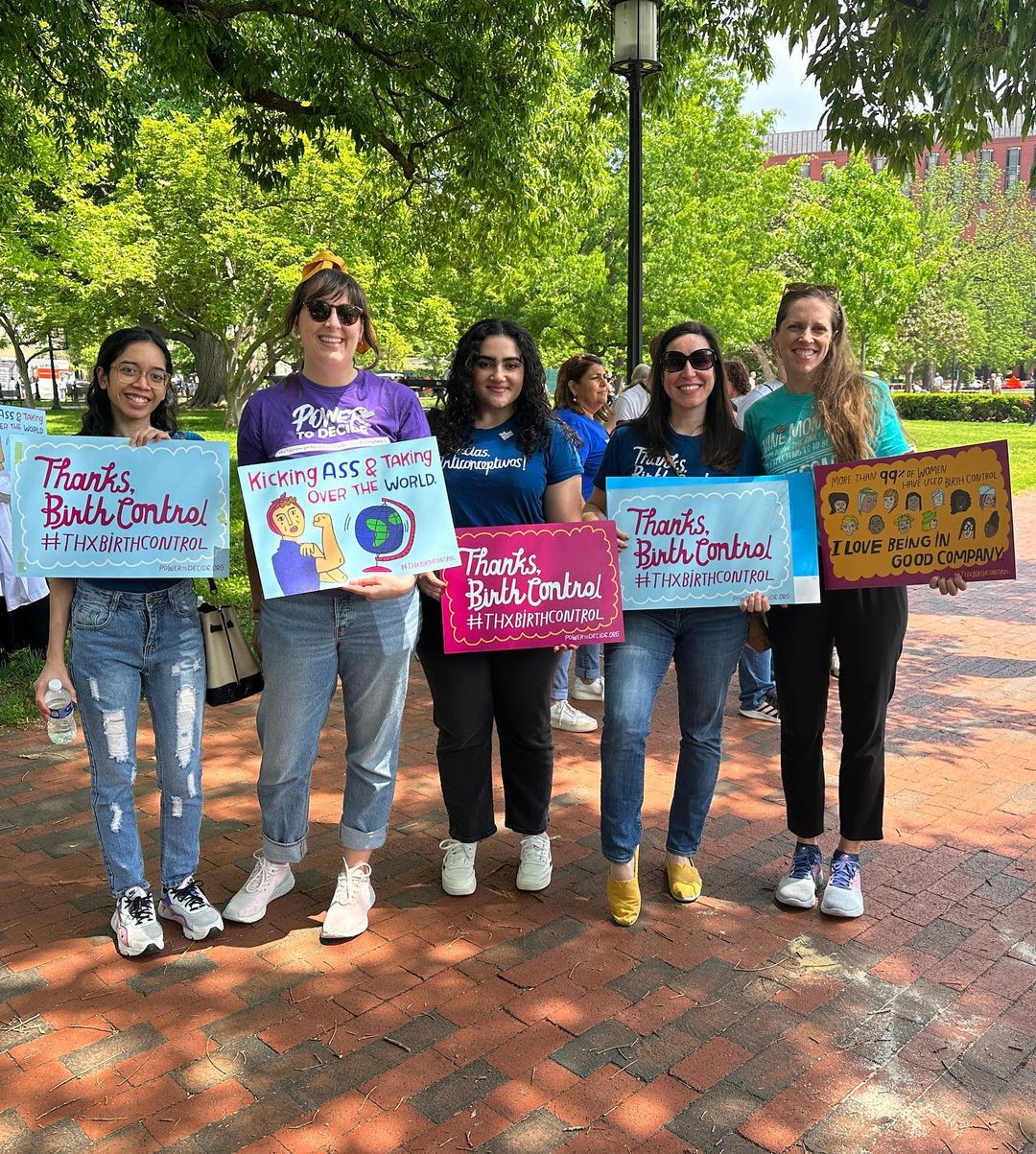 A group of Power to Decide staff hold signs that say "Thanks, Birth Control"