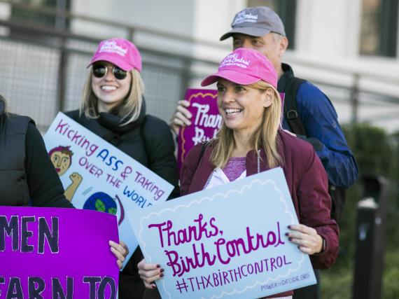 Power to Decide CEO at a rally with a sign that reads, "Thanks, Birth Control #ThxBirthControl"