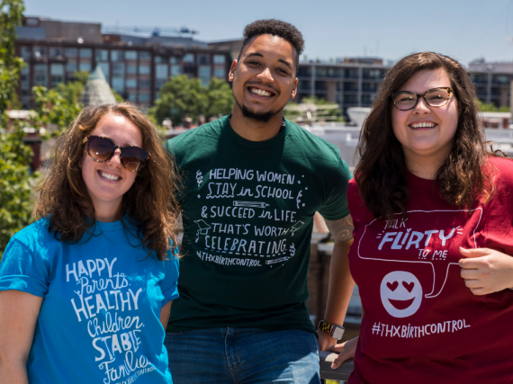 Three people wearing Thanks, Birth Control shirts