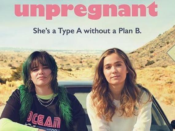 The movie poster for the movie "Unpregnant." It shows the two main characters sitting on the hood of a car in the desert. 