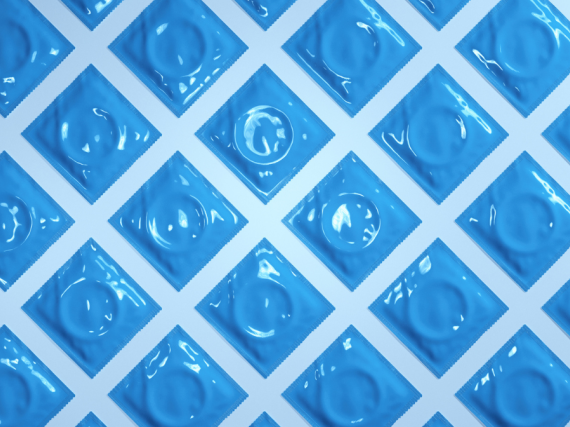 A photo of blue condoms laid out in rows. 