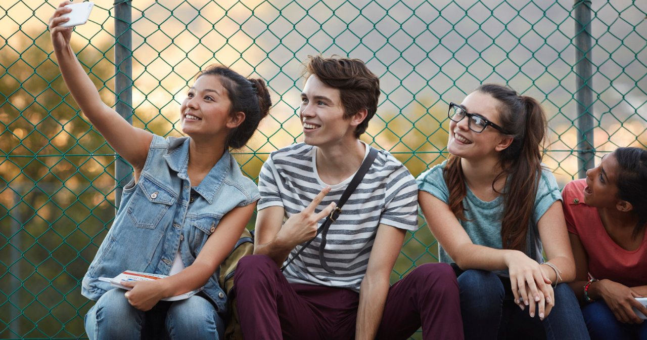 Four teen friends take a selfie
